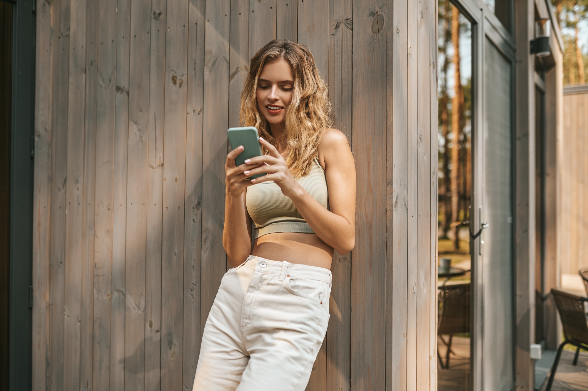 Woman looking at smartphone screen with interest